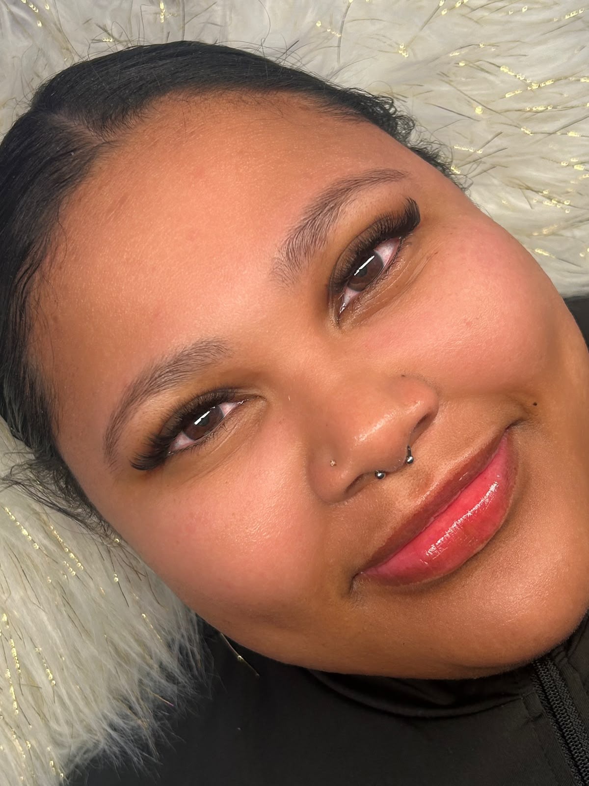 Smiling client wearing a full lash set