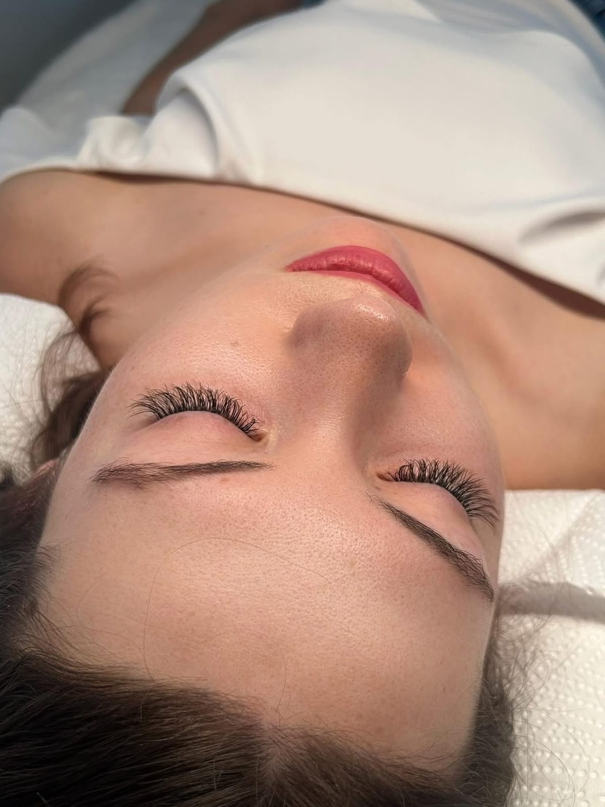 Client relaxing on the lash bed at Lashes by Dee, Paarl